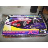 A Scalextric Formula 1 X 3 racing set.