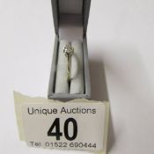 A diamond single stone 0.25ct ring in a 9ct gold shank, size K half.