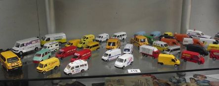 A box of die cast construction themed model vehicles.