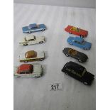 8 Corgi toys including Ford, Triumph, Jaguar etc.
