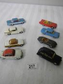 8 Corgi toys including Ford, Triumph, Jaguar etc.