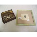 A framed and glazed Chinese ancient style coin Bu Bi and a tin of relics