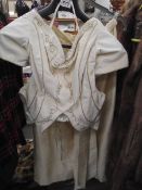 A quality cream pure silk and velvet two piece suit with gold braidwork to bodice, tailor made,