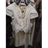 A quality cream pure silk and velvet two piece suit with gold braidwork to bodice, tailor made,