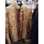 A fur jacket. (in good condition).