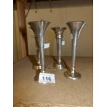 4 silver spill vases.