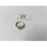 A hand made two tone gold diamond solitaire ring, size N.
