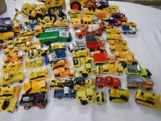 Approximately 75 construction themed die cast vehicles.