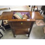 A 1930's oak sewing box with contents.