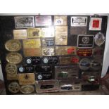 A display board of 1980s steam and vintage rally plaques