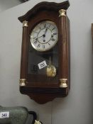 A modern Hermle Westminster chime wall clock.