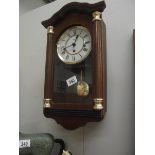 A modern Hermle Westminster chime wall clock.