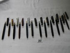 A good collection of fountain pens (4 with gold nibs) and a quantity of ball point pens.