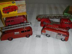 A boxed Dinky Airport fire tender and 3 other fire engines.