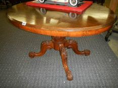 A Victorian mahogany tip top dining table.