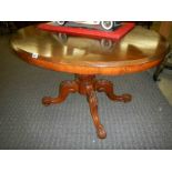 A Victorian mahogany tip top dining table.