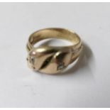 A gent's gold twist ring, size S. Approximately 7 grams.