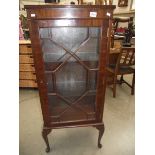 An Edwardian mahogany astragal glazed single door display cabinet.