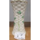 A Belleek vase decorated with shamrocks, 14 cm tall.