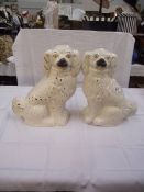 A pair of vintage Staffordshire mantlepiece dogs