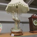 A table lamp in the form of a pair of storks complete with shade, Tail on one bird a/f.