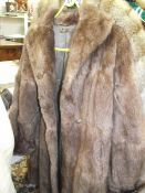 A fur coat. (repairs to lining, otherwise good).