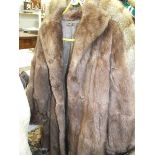 A fur coat. (repairs to lining, otherwise good).