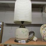 A Belleek table lamp with shade.