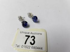 A pair of 14ct gold diamond and sapphire earrings.