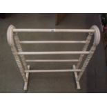 A painted wooden towel rail.