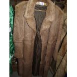 A fur coat. (in good condition).