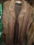 A fur coat. (in good condition).