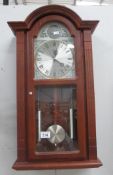 A modern quartz Acctim Westminster chime wall clock