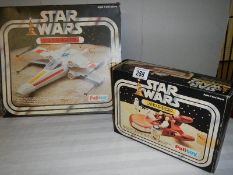 A boxed Palitoy Star Wars Land Speeder and X wing fighter,