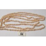 A one hundred inch long genuine pearl necklace.