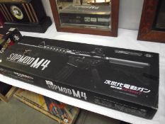 A boxed Airsoft SOPMODM4 gun by Tokyo Marui Co Ltd.