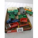 A mixed lot of Dinky caravans, trailers and farm implements etc.