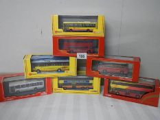 Seven die cast Corgi model buses.