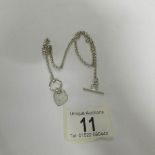 A silver 'T' bar neck chain, 11.9 grams.