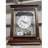 A caned 'Rythm' Westminster bracket/mantle clock.