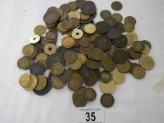 A box of assorted coins including George III, Victorian gaming tokens etc.