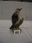 A Beswick Lesser Spotted Woodpecker No 2429 ( a/f underneath on tip of tail,