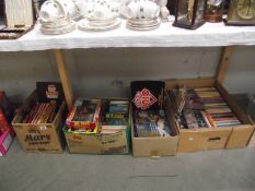 4 boxes of Doctor Who books. jigsaws, magazines etc.