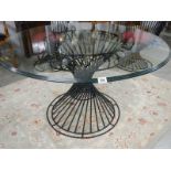 A top quality designer glass top table and 4 matching chairs.