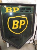A painted metal BP motor spirit sign.