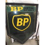 A painted metal BP motor spirit sign.