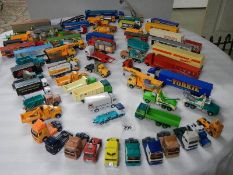 In excess of 60 cars and lorries, die cast and plastic.