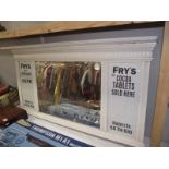 A bevel edge mirror with painted frame and Frys Cocoa advertising to sides.