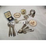 A mixed lot including s/p spoons, Hummel plates, Hummel picture paperweight, German music box,