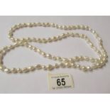 A thirty eight inch long pearl necklace.